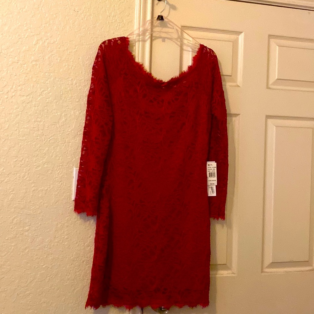 This is  a beautiful red lace fully lined cocktail dress
